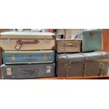 A banded trunk together with three suitcases,