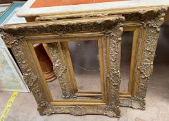 A pair of gilt decorated picture frames