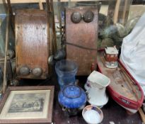 Two wooden wall mounted telephones together with a model ship,