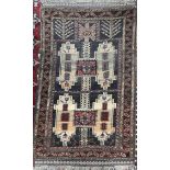 A small rug, with a brown ground, and geometric medallions,