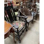 A 19th century carved oak elbow chair,