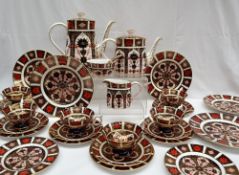 A Royal Crown Derby 1128 Imari pattern part tea set, comprising a hot water pot, teapot, cream jug,