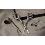 A continental white metal and enamel decorated sewing set, comprising scissors, thimble,