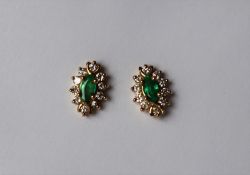 A pair of emerald and diamond earrings,