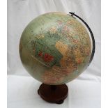 A Philips' Challenge Globe, Scale 1:37,500,000, on a turned wooden stand,
