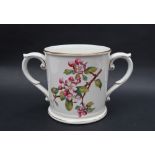 A Royal Worcester loving cup, transfer and infil decorated with flower blossoms, 13.