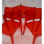 A set of four red injected polycarbonate Gyza stacking dining chairs CONDITION REPORT: