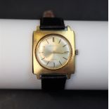 A Gentleman's yellow metal wristwatch, the circular dial with baton markers, inscribed "J.P.