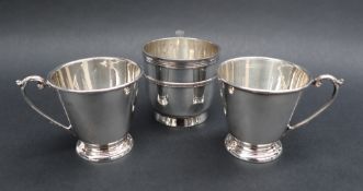 A pair of Elizabeth II silver christening mugs, of tapering form, with a spreading foot, Birmingham,