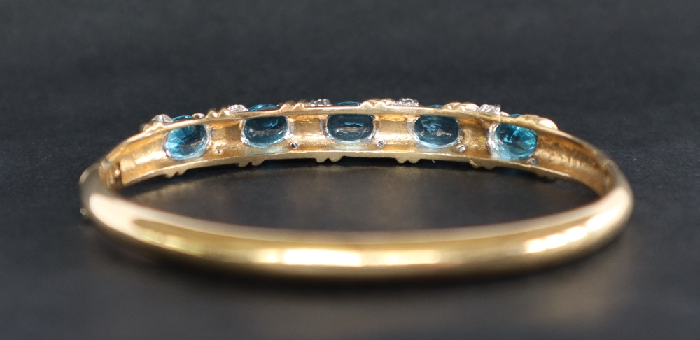 A 14ct yellow gold blue topaz and diamond set hinged bangle, - Image 3 of 5