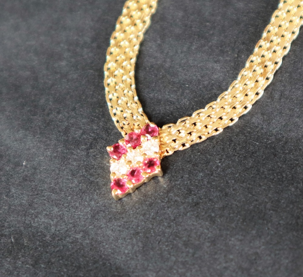 A 14ct yellow gold ruby & diamond necklace,