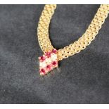 A 14ct yellow gold ruby & diamond necklace,