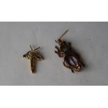 An 18ct yellow gold sapphire and diamond insect pendant set with two pointed oval sapphire wings
