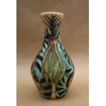 A Moorcroft pottery vase decorated with tight buds and scrolling fronds, dated 2004, 14cm high,
