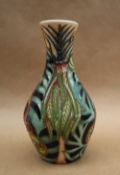 A Moorcroft pottery vase decorated with tight buds and scrolling fronds, dated 2004, 14cm high,