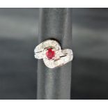 An 18ct white gold ruby and diamond ring,