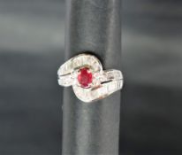 An 18ct white gold ruby and diamond ring,