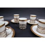 A wedgwood coffee set, with gilt rim and Greek key motif, with silver sleeves, Sheffield,