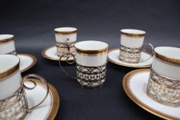 A wedgwood coffee set, with gilt rim and Greek key motif, with silver sleeves, Sheffield,
