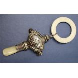 A George V silver and mother of pearl baby's rattle, with a white plastic teething ring,