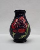 A Moorcroft pottery anemone pattern vase with a royal blue ground, impressed and painted marks,