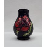 A Moorcroft pottery anemone pattern vase with a royal blue ground, impressed and painted marks,