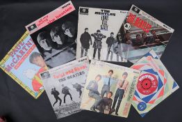 A Beatles 45 Please Please me on Parlophone red label together with five Beatles EP's including ,