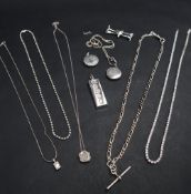 A silver ingot together with silver necklaces,