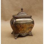 An Edward VII silver tea caddy of bombe shape, with a flame finial,