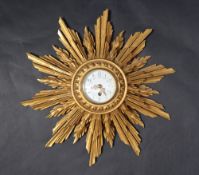 A French carved giltwood Sunburst wall clock,