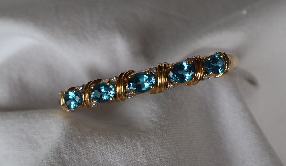 A 14ct yellow gold blue topaz and diamond set hinged bangle, - Image 2 of 5