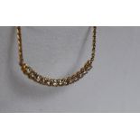 A 14ct yellow gold diamond set necklace,