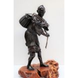 A BRONZE OKIMONO OF A FISHERMAN By Ryusai for the Maruki Company,