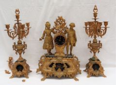 A 19th century French gilt spelter clock garniture, depicting two figures,