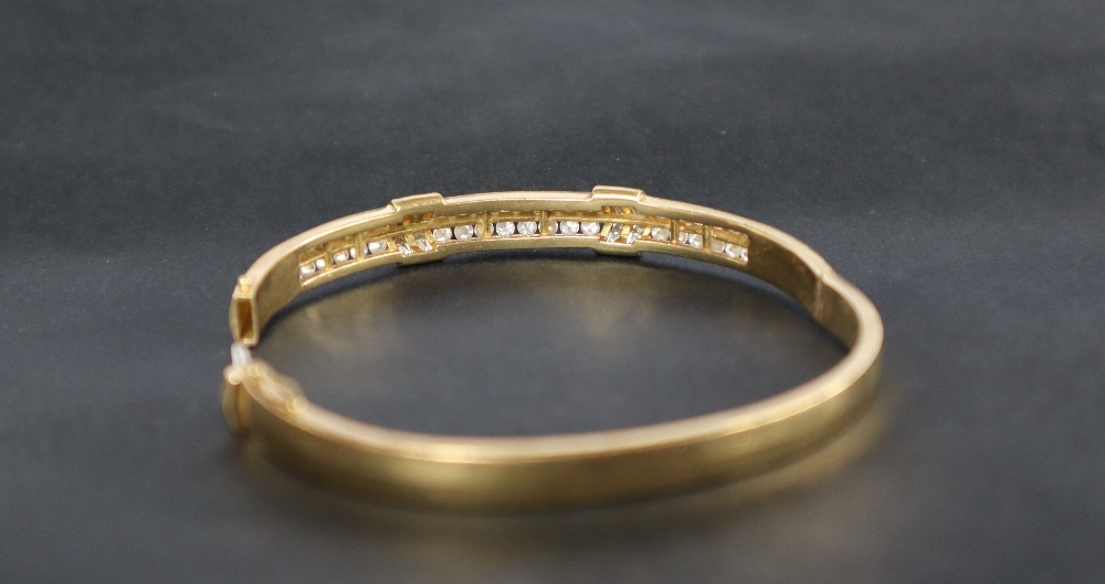 An 18ct yellow gold diamond set hinged bangle, set with two rows of brilliant cut diamonds, - Image 3 of 4