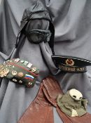 A pair of World War II leather flight gloves together with a pair of goggles, mask cover,