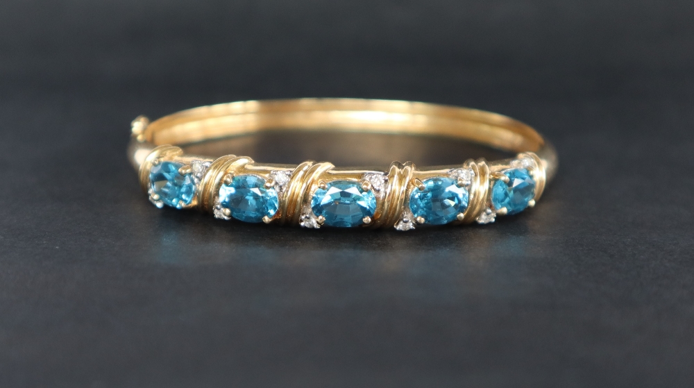 A 14ct yellow gold blue topaz and diamond set hinged bangle, - Image 5 of 5