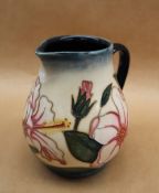 A Moorcroft Limited Edition 'Hibiscus Moon' pottery jug designed by Sian Leeper, No.