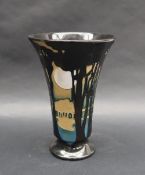 A Moorcroft pottery limited edition flared vase decorated with a moonlit scene with trees in the