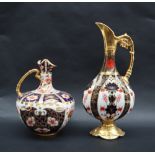 A Royal Crown Derby 1128 Imari pattern ewer with a shaped spout and faux bamboo handle,