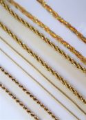 A 9ct yellow gold rope twist necklace together with three other 9ct gold necklaces,