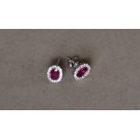 A pair of ruby and diamond earrings,