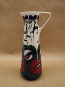 A Moorcroft pottery slender jug decorated in the Charles Rennie Macintosh pattern, dated 95,