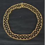 An 18ct yellow gold diamond set necklace, set with seventy three round brilliant cut diamonds,