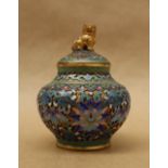 A cloisonne enamel vase and cover with a dog of foo surmount,