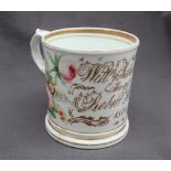 A 19th century porcelain mug painted with flowers and leaves inscribed "Willm & Rebecca Todd,
