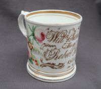 A 19th century porcelain mug painted with flowers and leaves inscribed "Willm & Rebecca Todd,