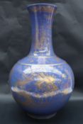 A Chinese blue ground gilt dragon decorated bottle vase,