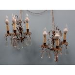 A pair of gilt metal three branch lustre drop wall lights,