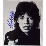 Mick Jagger - A black and white photograph, signed in blue pen, 24.5 x 20.